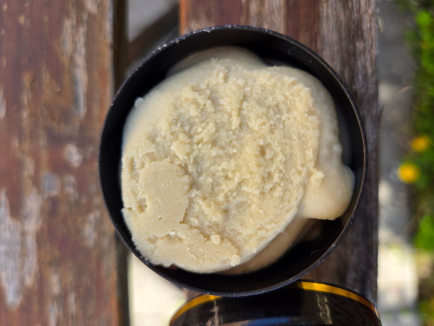 Starriel Beard Butter in a black jar, creamy texture.
