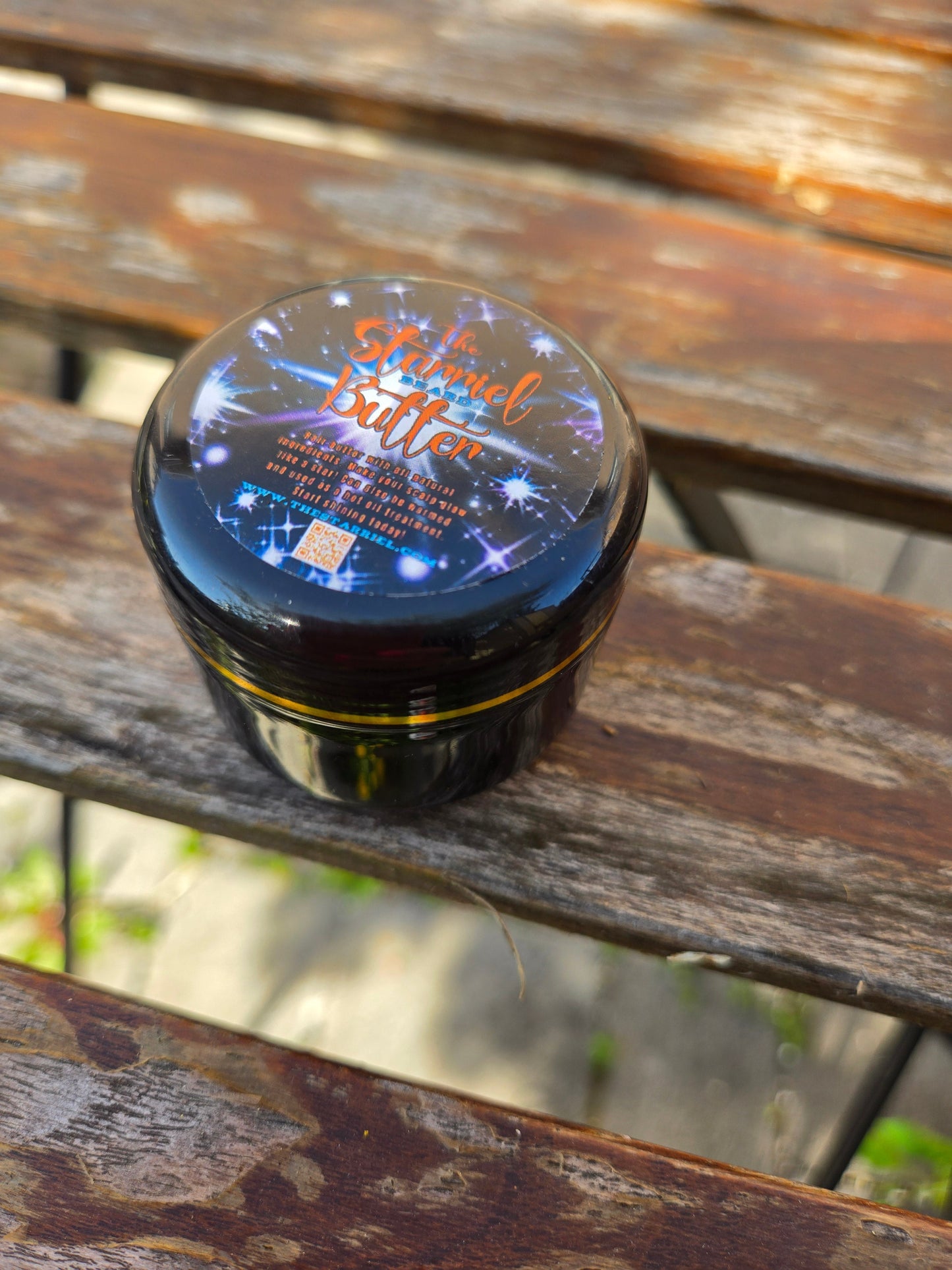 Starriel Beard Butter jar on a wooden surface.