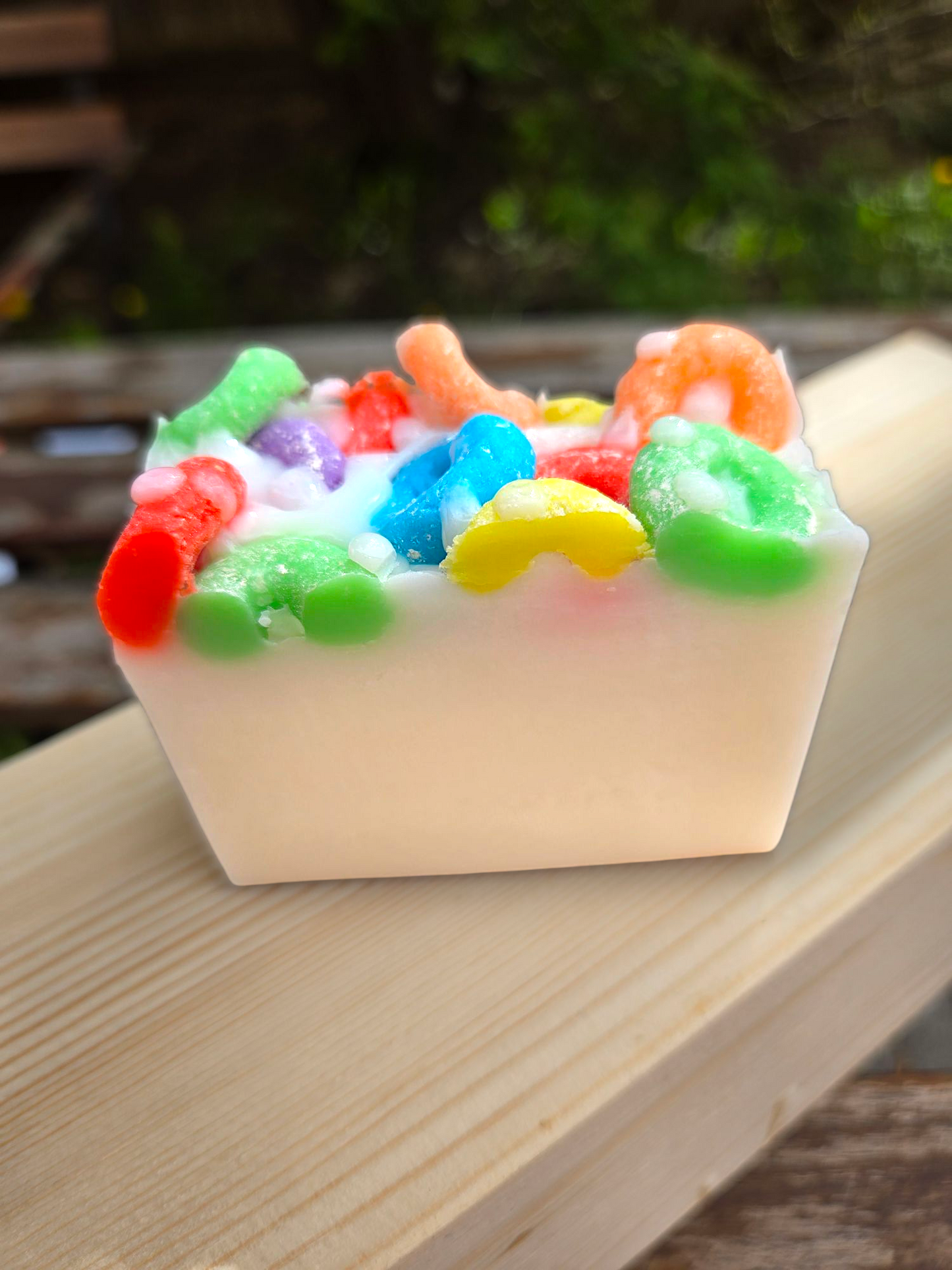 Frooty Loops Bar Soap with colorful cereal design on a wooden surface.