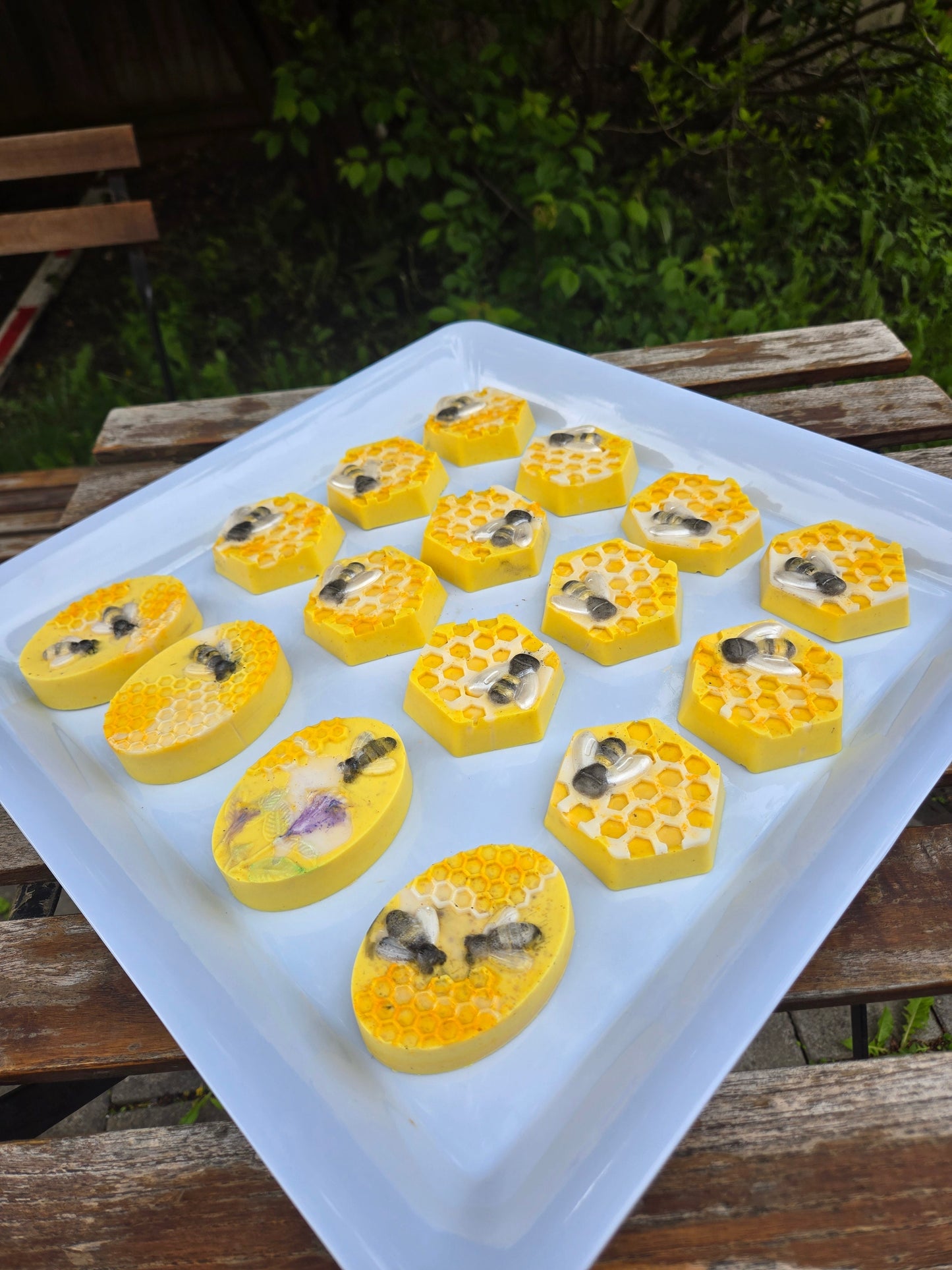 Honey Bar with turmeric and honey, featuring hexagonal and oval shapes on a tray.