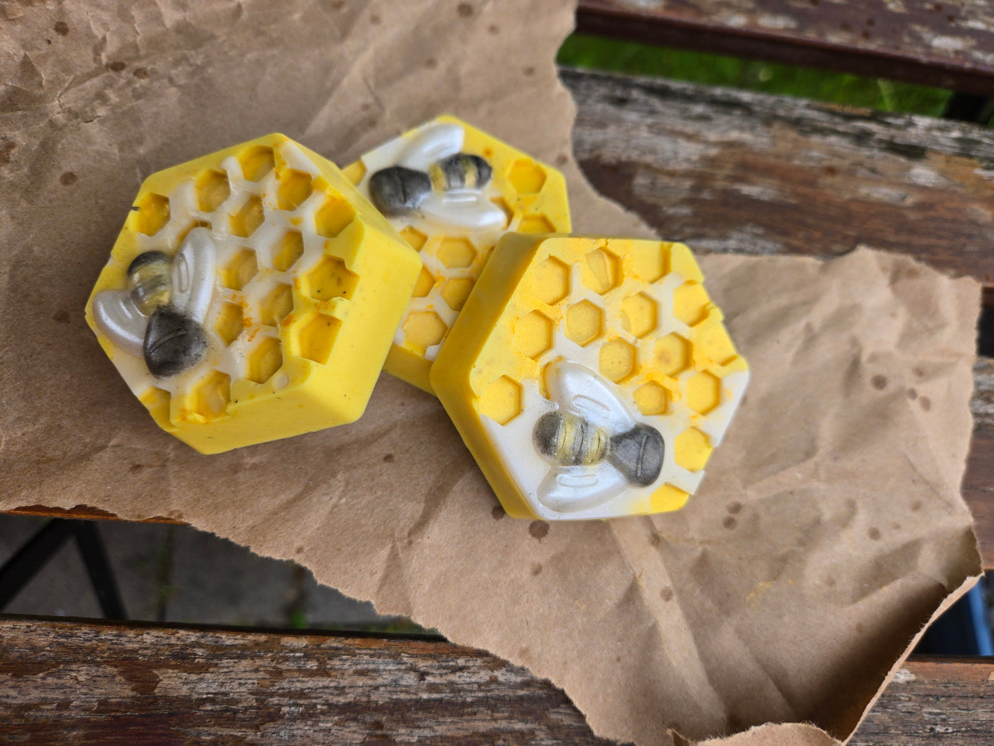 Honey Bar with honeycomb design and bee accents on brown paper.