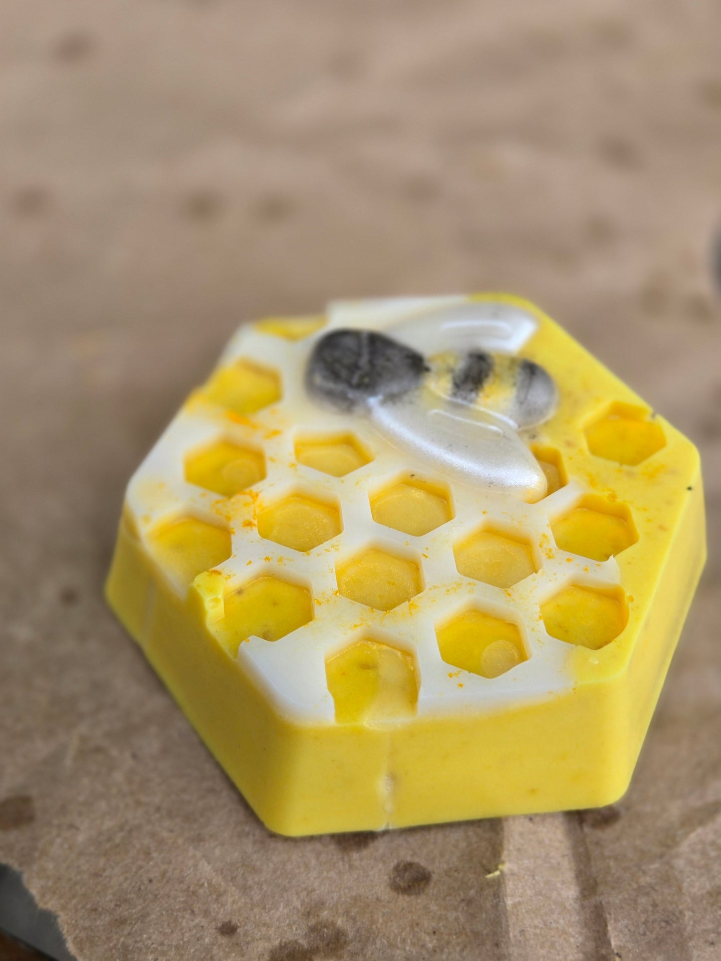 Honey Bar soap with honeycomb design and bee, featuring turmeric and nourishing butters.