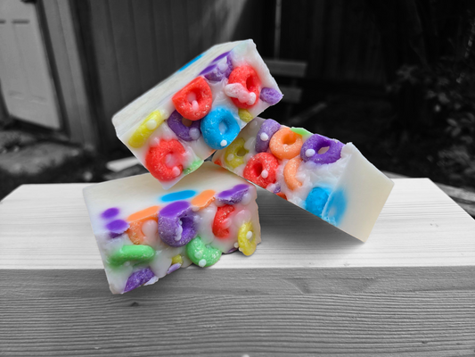 Frooty Loops Bar Soap with colorful cereal-inspired design on a wooden surface.