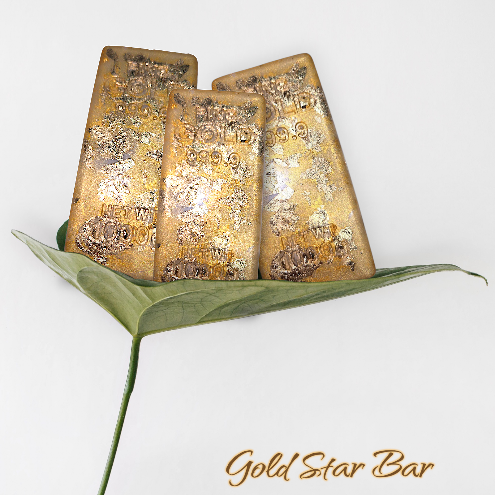 Gold Star Bar soap with moisturizing vegan formula on leaf.