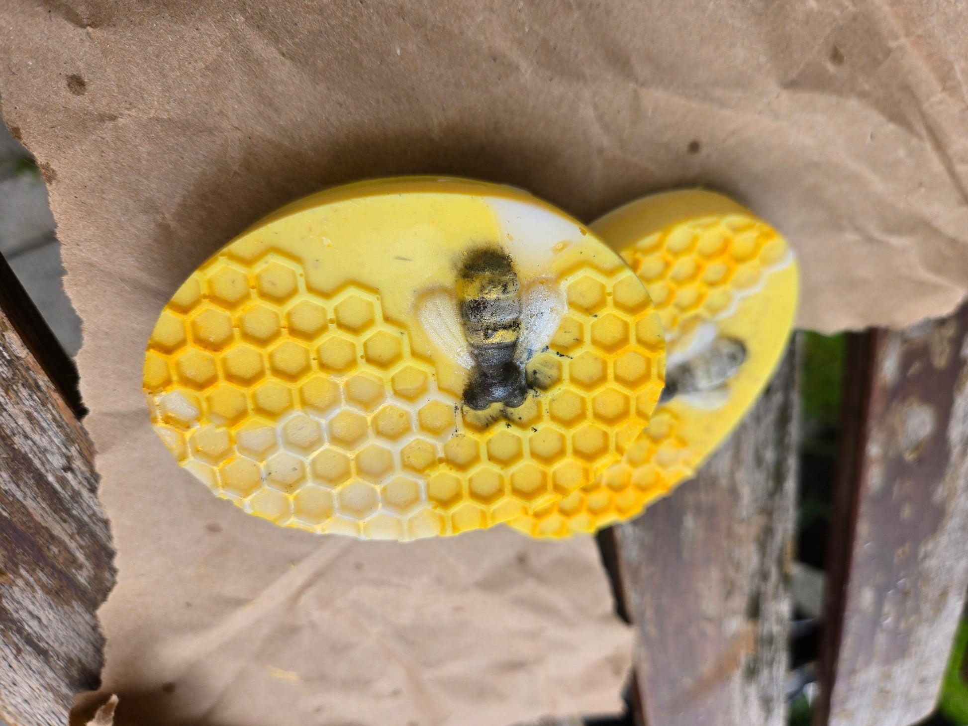 Honey Bar with honeycomb pattern and bee design, ideal for skin cleansing and exfoliation.